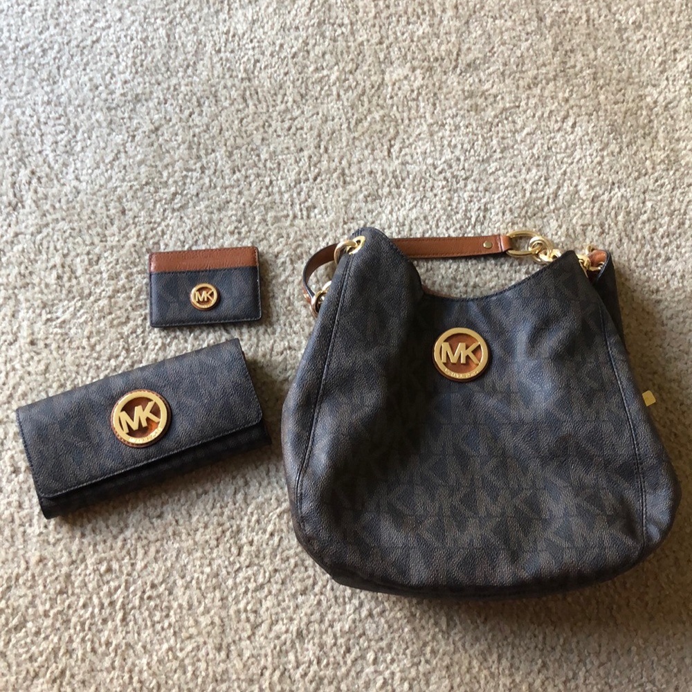 Michael Kors bag, wallet, and car holder.